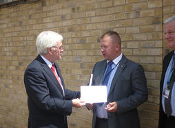 John McDonnell giving letter to EVRAZ